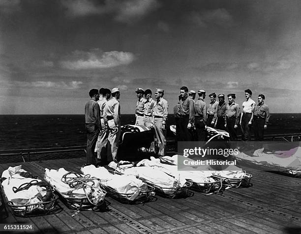 The Navy buries its dead at sea from the USS Lexington after being attacked by a Japanese kamikaze plane, ca. 1941-1945. | Location: aboard the USS...