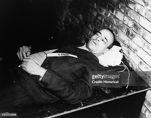 The corpse of Nazi war criminal Hans Frank after his execution by hanging. Frank, the governor of Poland after its invasion in 1939, was judged...