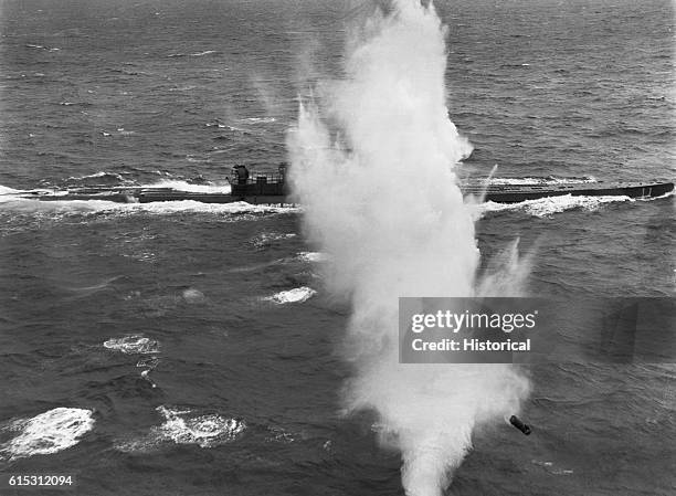 German submarine attacked near Acsension Island puffs smoke after being hit by a Navy aircraft. World War II. North Atlantic.