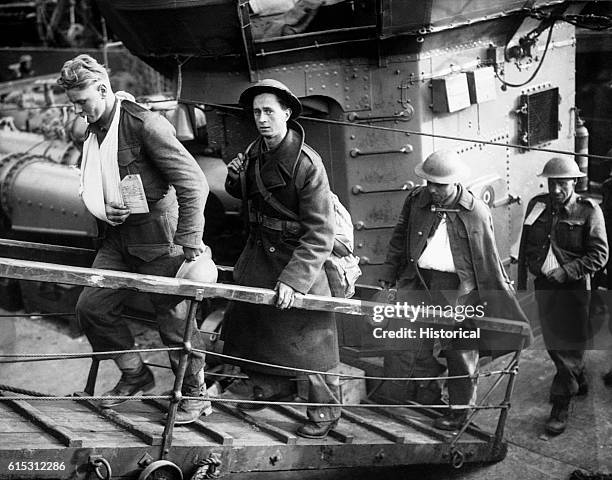 British evacuees from Dunkirk walk off their rescue vessel after landing in Britain. June 1940.
