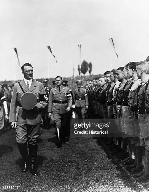 Hitler, accompanied by Hitler Jungendfuhrer Baldur von Schirach , inspects a formation of the Hitler Youth.