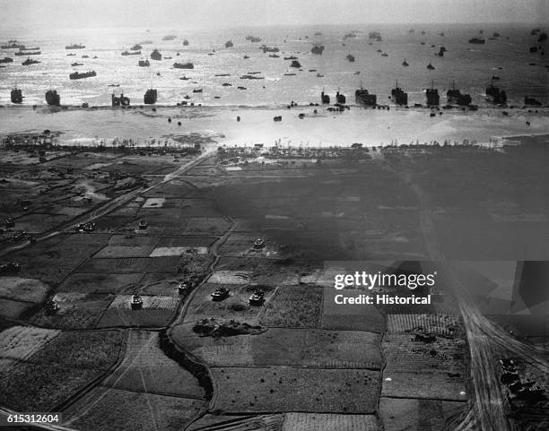 S land on the beach at Okinawa during an allied attack on the Pacific island, held by the Japanese during World War II. 1945.