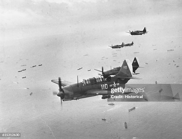 Helldiver aircraft from carriers of Task Force 58 are on their way to support Marines assaulting Iwo Jima in the Volcano Islands. Ca. February-March...