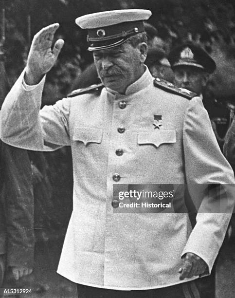 Stalin at the Potsdam conference in 1945, wearing a military uniform. The dictator's withered left arm, usually hidden, is clearly visible.
