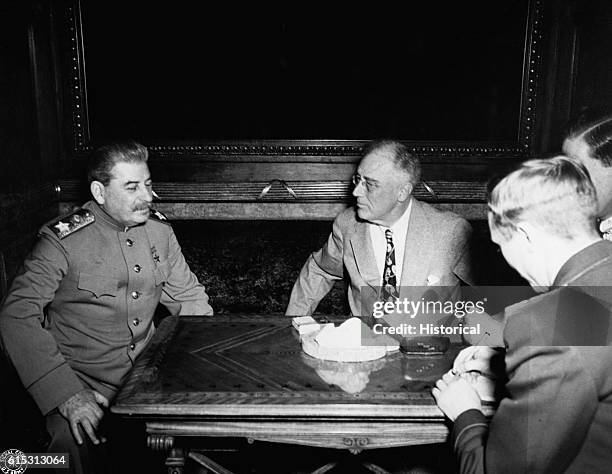 Soviet premier Joseph Stalin and U.S. President Franklin D. Roosevelt talk during the Yalta Conference of 1945. Roosevelt, Stalin, and Winston...