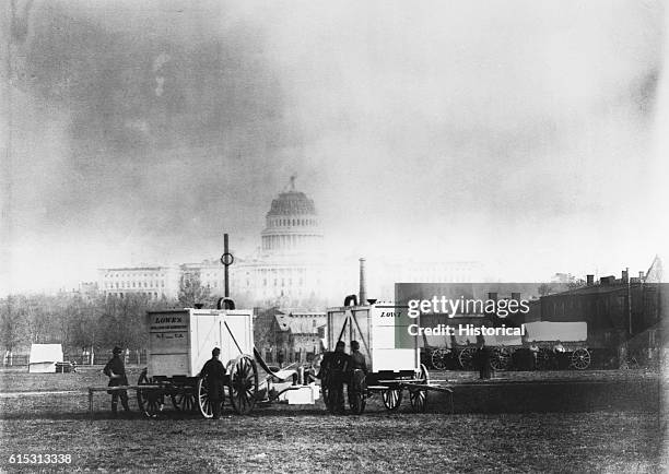 Professor Thaddeus Lowe sets up balloon gas generators in sight of the U.S. Capitol, Washington, D.C., ca. 1861.