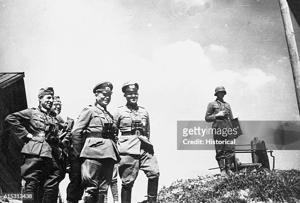 Generaloberst Guderian and a few of his officers watch a bridge in the USSR. Guderian was in large part the formulator and practitioner of the...