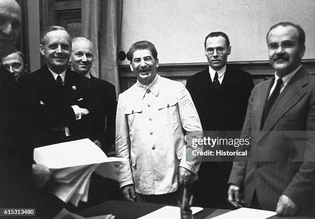 Vyacheslav Molotov , foreign minister for the USSR and Joachim von Ribbentrop , foreign minister for Germany at the signing of the Soviet-German...