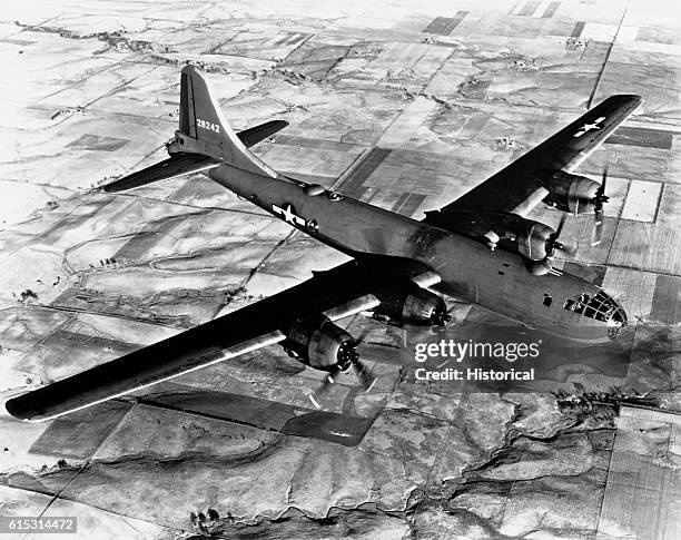 Aerial view of a B-29 flying over Japanese fields.