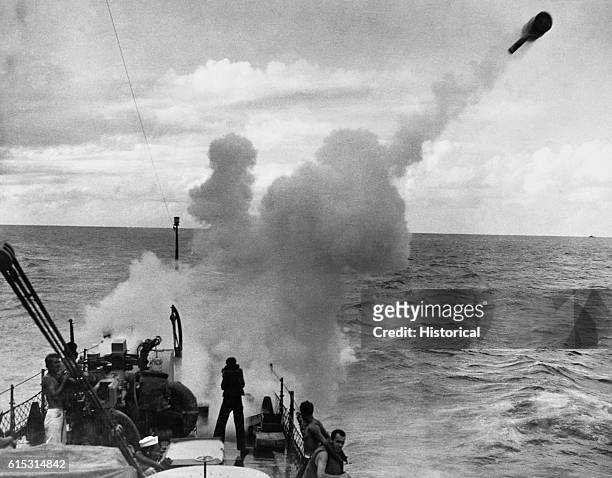Depth charge is shot from a "Y" gun on a PC boat patrolling in the North Atlantic. World War II.