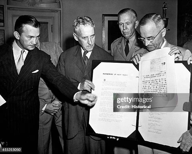 President Harry Truman displays the Japanese surrender document, September 7, 1945.