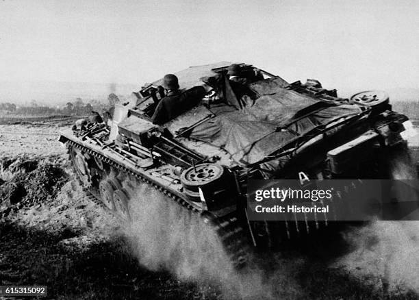 German tank roars across Poland near Grodno in June 1941, on its way to the Russian border in the initial phase of Hitler's Operation Barbarossa, the...