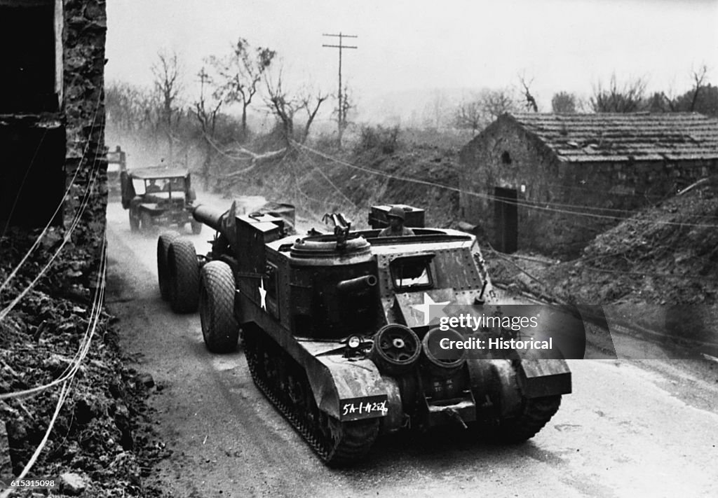 American Tank Pulling a Howitzer