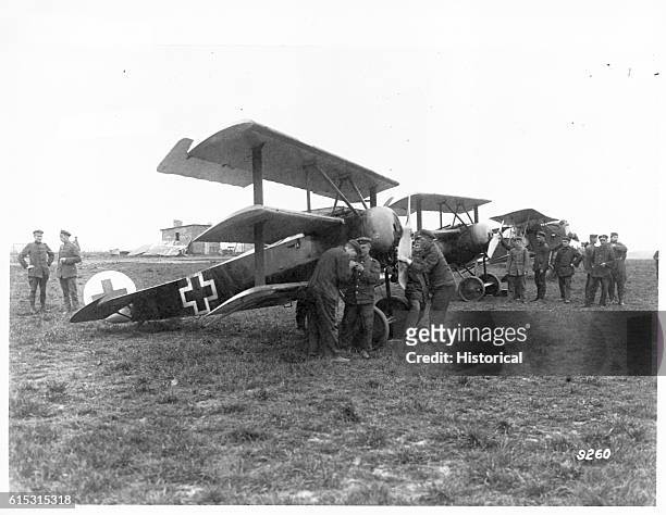 Ground mechanics work on Fokker military triplanes. Germany, 1914-1918.