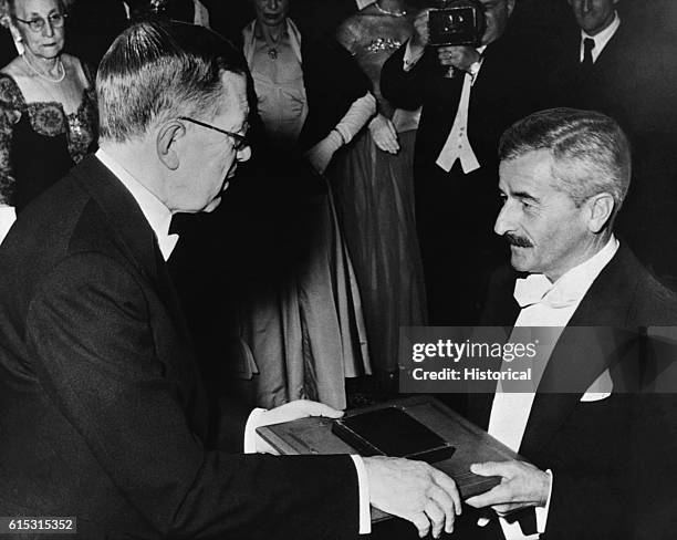 Author William Faulkner receives the 1949 Nobel Prize for literature from King Gustaf Adolf VI of Sweden.