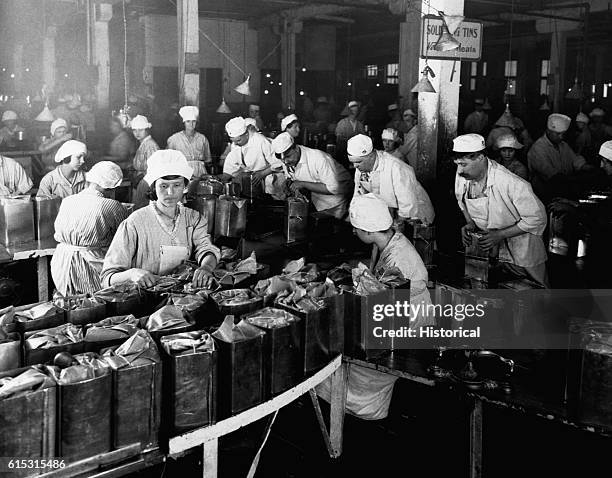 Armour and Company, Chicago -- Workers are wrapping and packing bacon at the Armour and Company plant in Chicago. January 1919.
