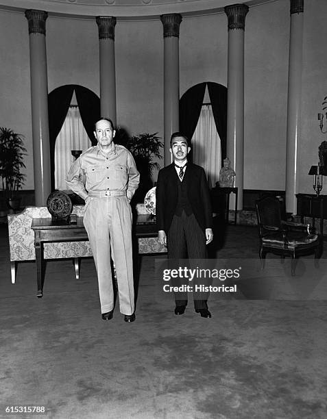 Emperor Hirohito is received by General Douglas MacArthur, U.S. Commander of the Japanese occupation, at the U.S. Embassy in Tokyo. The Emperor is...