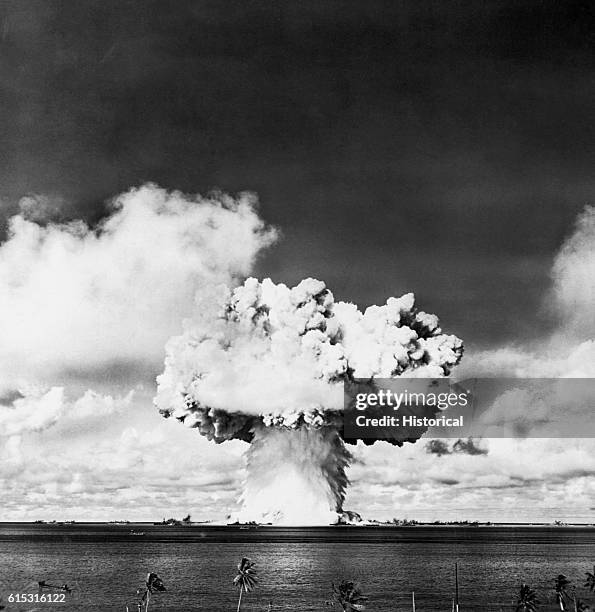 Column of water and a cloud of smoke from a nuclear bomb test conducted by the United States.