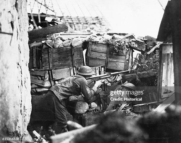 American shooters hold this outpost in the Vosges with a French automatic rifle.