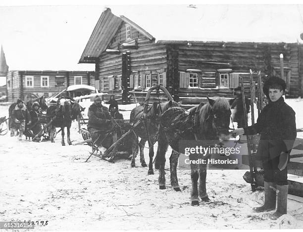 Colonel George E. Stewart, commanding American forces in Northern Russia, passing by convoy through village of Chamova on his return from Dwina River...