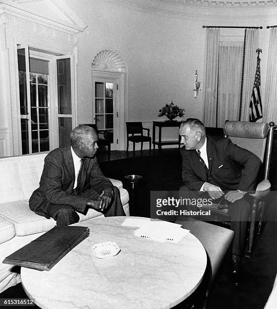 Chair Roy Wilkins speaks with US President Lyndon Johnson, mid 1960s.