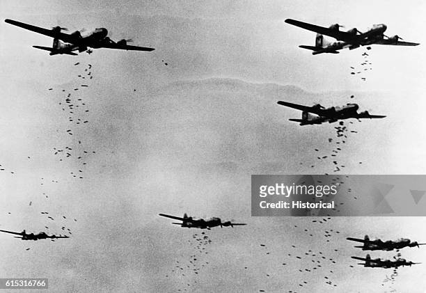 Bombers drop hundreds of incendiary bombs on Yokohama, Japan, during an air raid on May 29, 1945. | Location: over Yokohama, Japan.