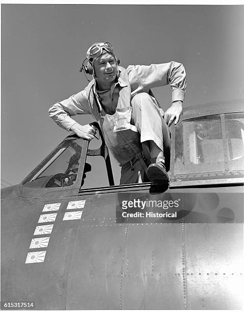 Lt. Cdr Paul D. Buie climbs from the cockpit of his F6F on board the USS Lexington . He has just returned from intercepting the enemy on the...