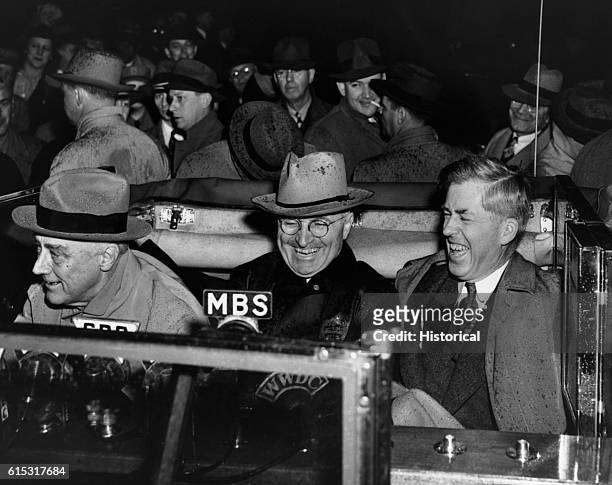 Vice President-elect Harry Truman sits between President Roosevelt and the outgoing Vice President Henry Wallace during radio broadcast on November...
