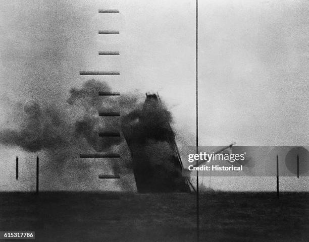 Medium-sized Japanese cargo ship sinks bow-first, almost straight down, after being torpedoed by the submarine USS Wahoo, under the command of Lt....