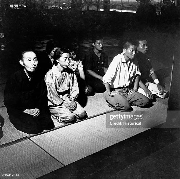Residents of Hiroshima attend Shinto services for friends and relatives killed in the atom bomb blast. Hiroshima, 1945.