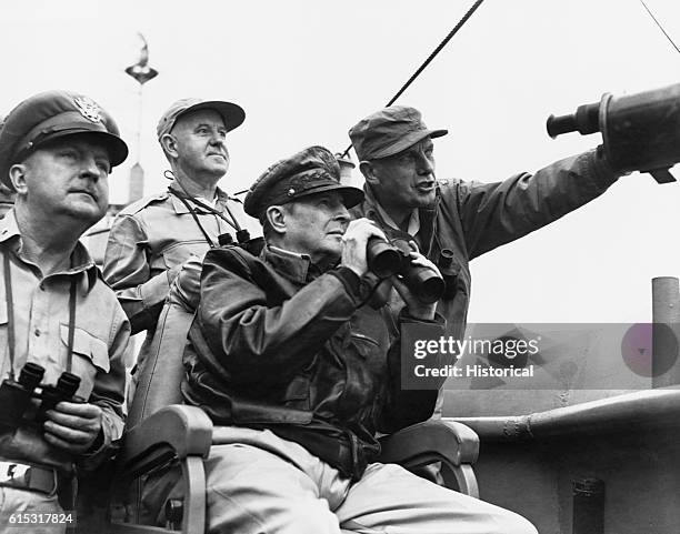 General Douglas MacArthur, General Whitney, and General Almond observe the progress of shelling the enemy before the landing at Inchon. | Location:...