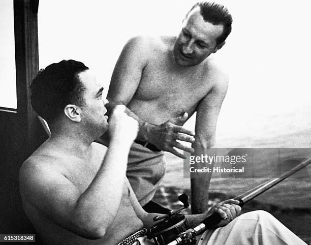 Edgar Hoover relaxes with his friend Clyde A. Tolson. Hoover was the Director of the FBI from 1924-1972.