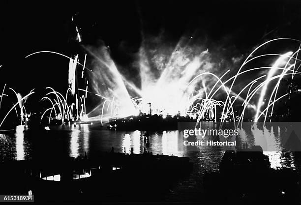 Fireworks go off in Pearl Harbor at Oahu, Hawaii, on V-J Day, August 15 in celebration of the unconditional surrender of Japan. The U.S. Entry into...