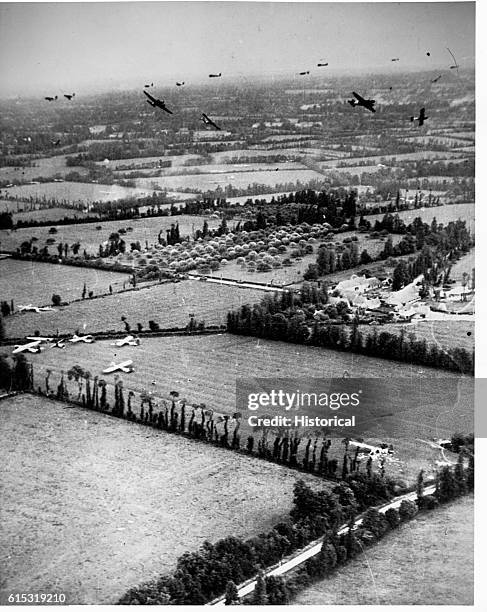 Gliders fly over the fields of Normandy, France, 1944.