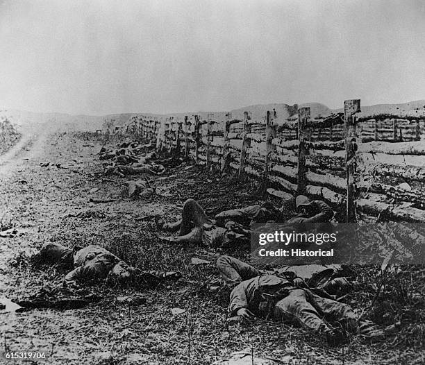 Confederate soldiers, killed during the Battle of Antietam, lie along a dirt road near Hagerstown Pike. | Location: Near Hagerstown, Maryland, USA.