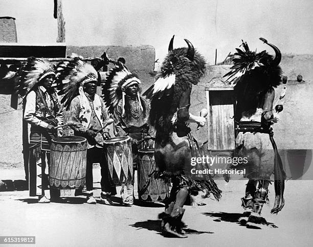 Pueblo Indians perform the buffalo dance, which was originally intended to induce good spirits to multiply the buffalo herd and insure good hunting.