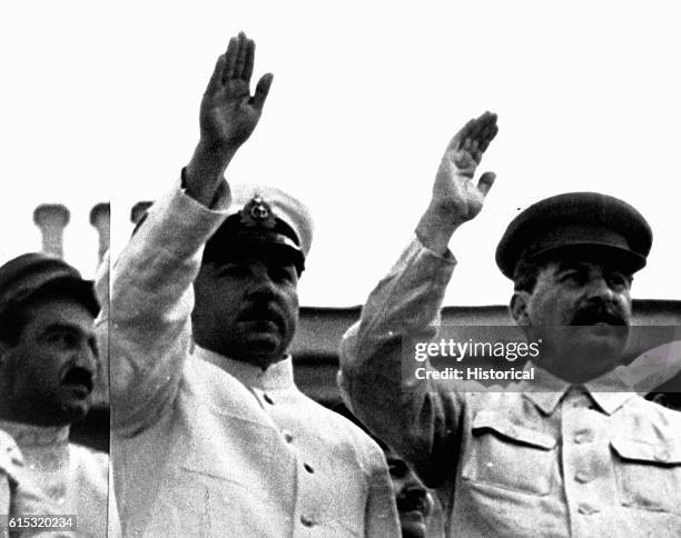 Anastas Mikoyan, Klimenti Voroshilov and Josef Stalin reviewing a sport parade in July 1935. Source: International News.
