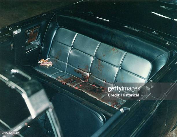 The interior of the Presidential limousine after the Kennedy assassination. Included as an exhibit for the Warren Commission. Ca. November, 1963.