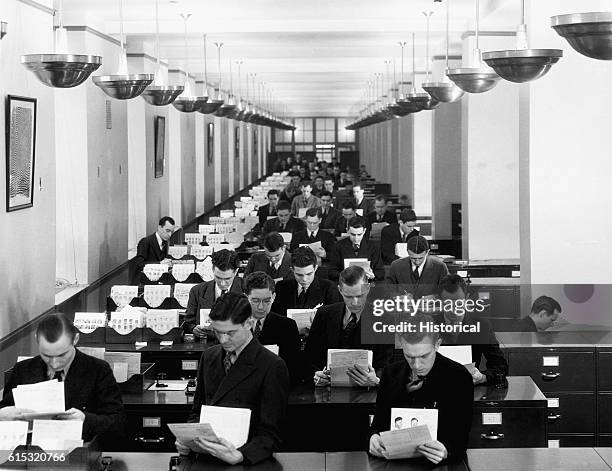 Specialists at work in the Bureau's Fingerprint Identification Division. Ca. 1930-1950.