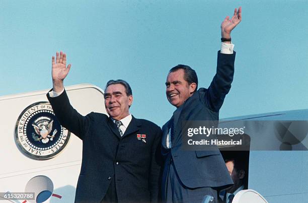 Richard Nixon and Premier Brezhnev wave from the doorway of Air Force One at San Clemente, California.