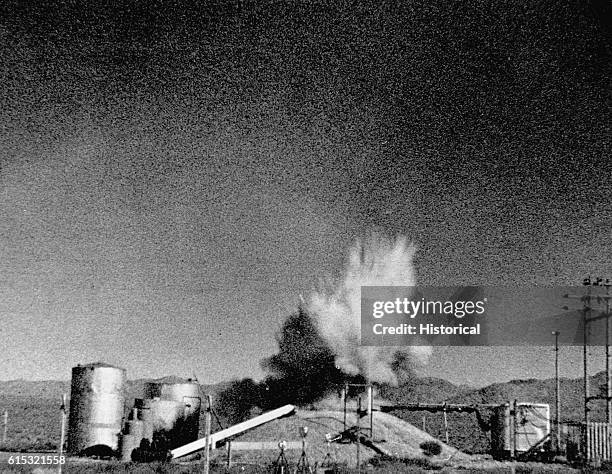 Scientists at the National Reactor Testing Station created this explosion by removing the control rod from a nuclear reactor buried under the earthen...