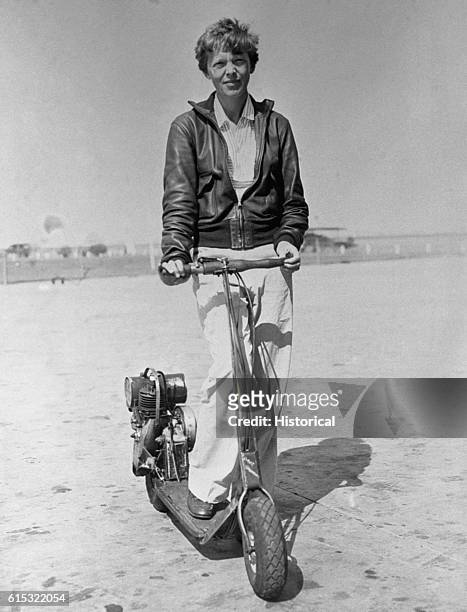 Amelia Earhart Holding Motorized Scooter
