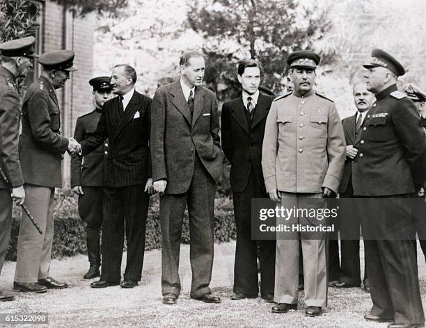 Harry Hopkins on the grounds of the Russian Embassy with General George Marshall, Marshal Josef Stalin, Foreign Minister Molotov, and General...