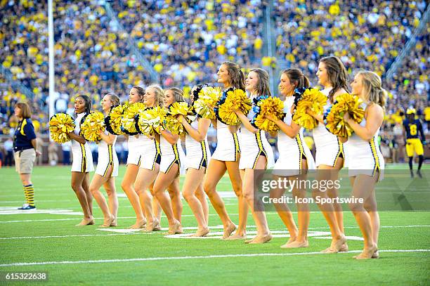 The Michigan dance team entertains the fans during a timeout during the game on Saturday afternoon, Michigan Stadium, Ann Arbor, Michigan.