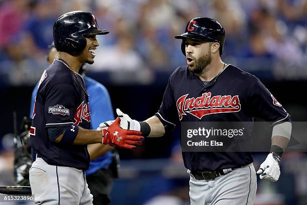 Jason Kipnis of the Cleveland Indians celebrates with his teammate Francisco Lindor after hitting a solo home run in the sixth inning against Marcus...