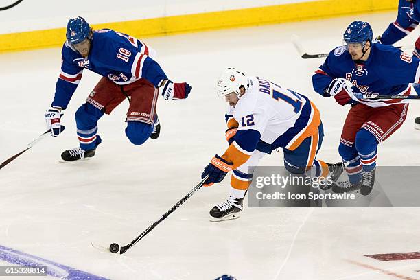 New York Islanders Left Wing Josh Bailey rushes across the blue line with the puck during the first period of opening night at Madison Square Garden...