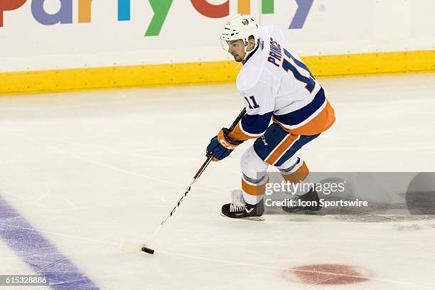 New York Islanders Center Shane Prince with the puck during the first period of opening night at Madison Square Garden in a NHL game between the New...