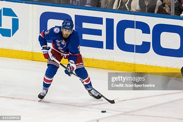 New York Rangers Center Brandon Pirri with the puck during the first period of opening night at Madison Square Garden in a NHL game between the New...