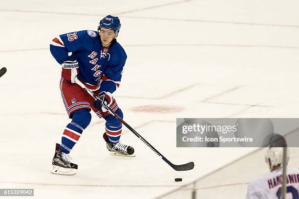 New York Rangers Left Wing Jimmy Vesey with the puck during the first period of opening night at Madison Square Garden in a NHL game between the New...