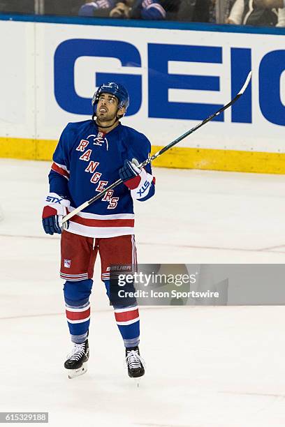 New York Rangers Center Brandon Pirri looks to the video board after missing a shot wide of the net during the first period of opening night at...